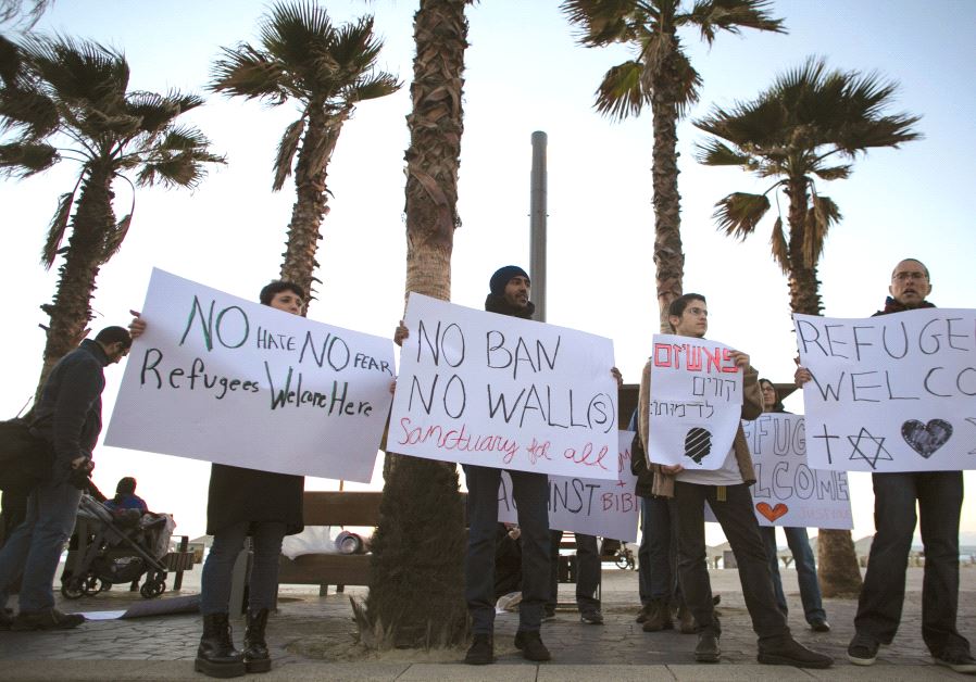 PROTESTERS hold placards during a rally supporting refugees worldwide and in reaction to US President Donald Trump’s travel ban outside the US Embassy in Tel Aviv last month