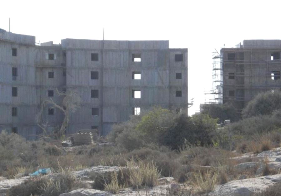 In Beit Shemesh, overlooking the valley from the northeast, construction of 14,000 planned housing units is now in full swing