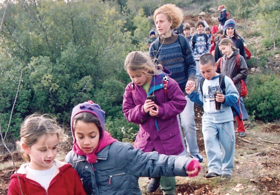 Children mark ‘the reawakening of the vitality of the land from its winter slumber’ on a recent Tu Bishvat