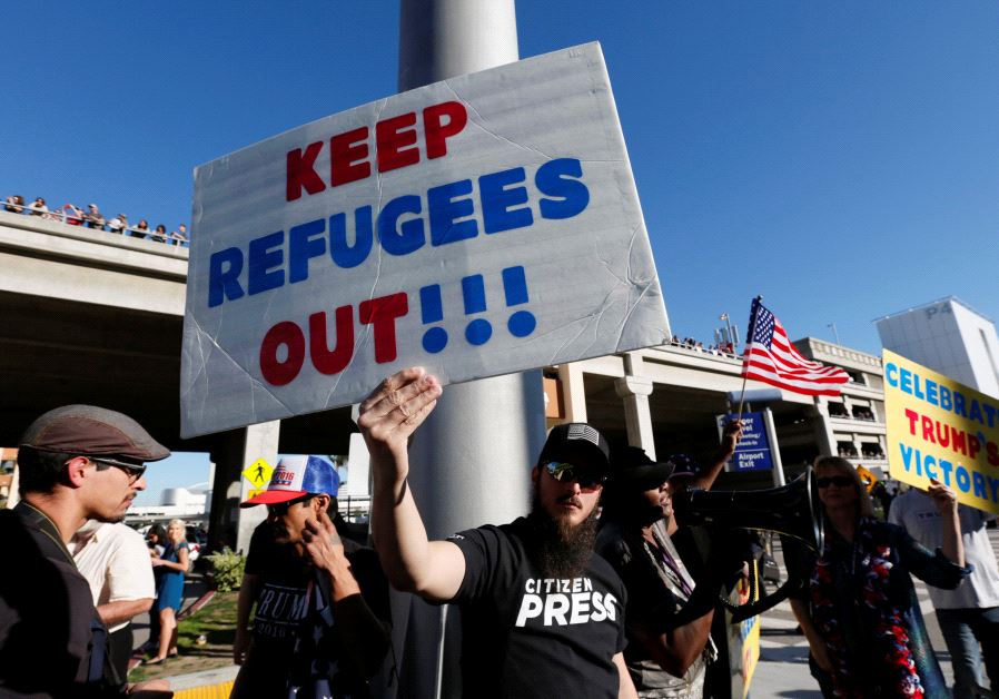 Pro-Trump demonstrators protest in support of the travel ban imposed by US President Donald Trump's executive order at Los Angeles International Airport in Los Angeles, California