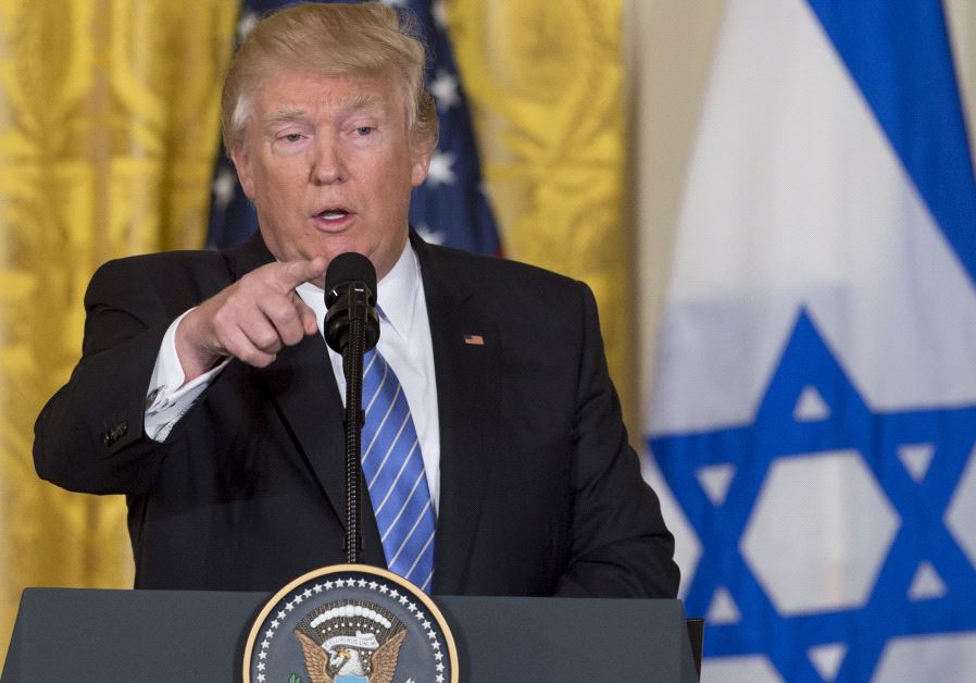 Donald Trump speaks during a joint press conference with Minister Benjamin Netanyahu in the East Room of the White House in Washington , DC on Feb. 15, 2017 with an Israeli flag in the background