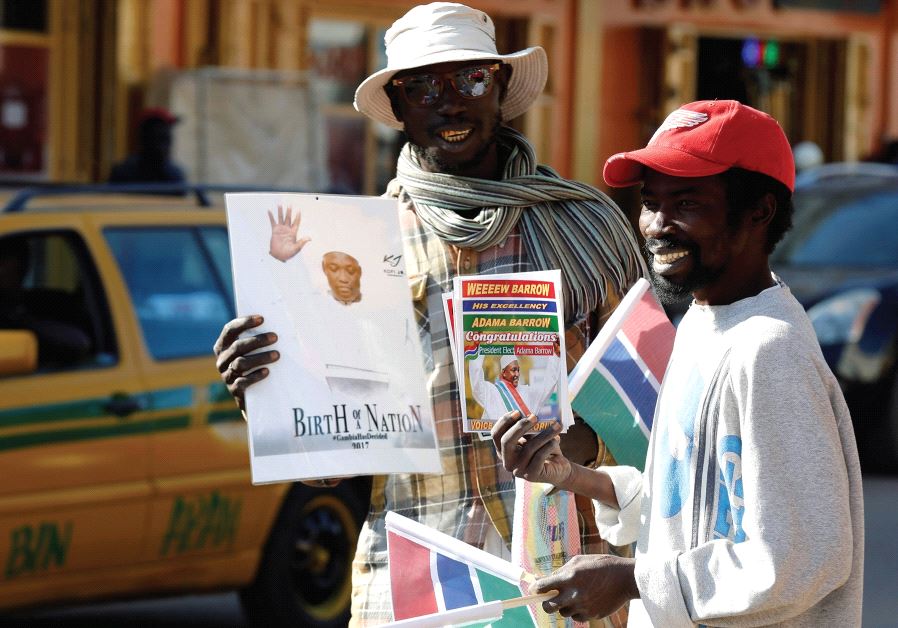 STREET SELLERS are seen with portraits of Gambia’s new president, Adama Barrow, in Serekunda, Gambia, last month