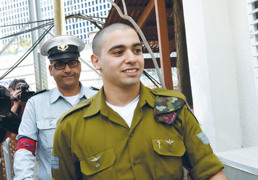SGT. ELOR AZARIA, convicted of manslaughter for killing a terrorist, arrives for a sentencing hearing at the Jaffa Military Court in Tel Aviv on January 24