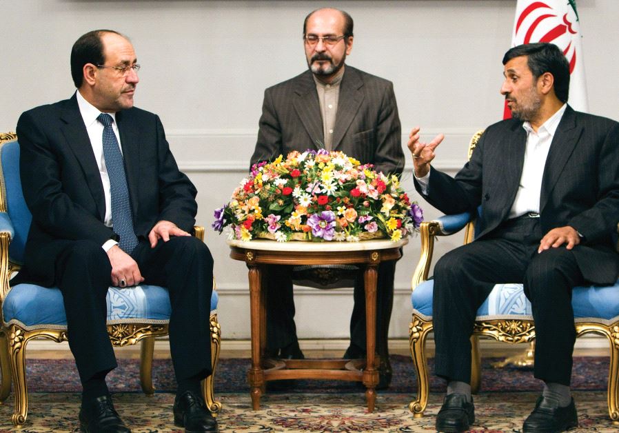 FORMER IRANIAN president Mahmoud Ahmadinejad (right) speaks with Iraqi Prime Minister Nuri al-Maliki (left) during a 2010 meeting in Tehran