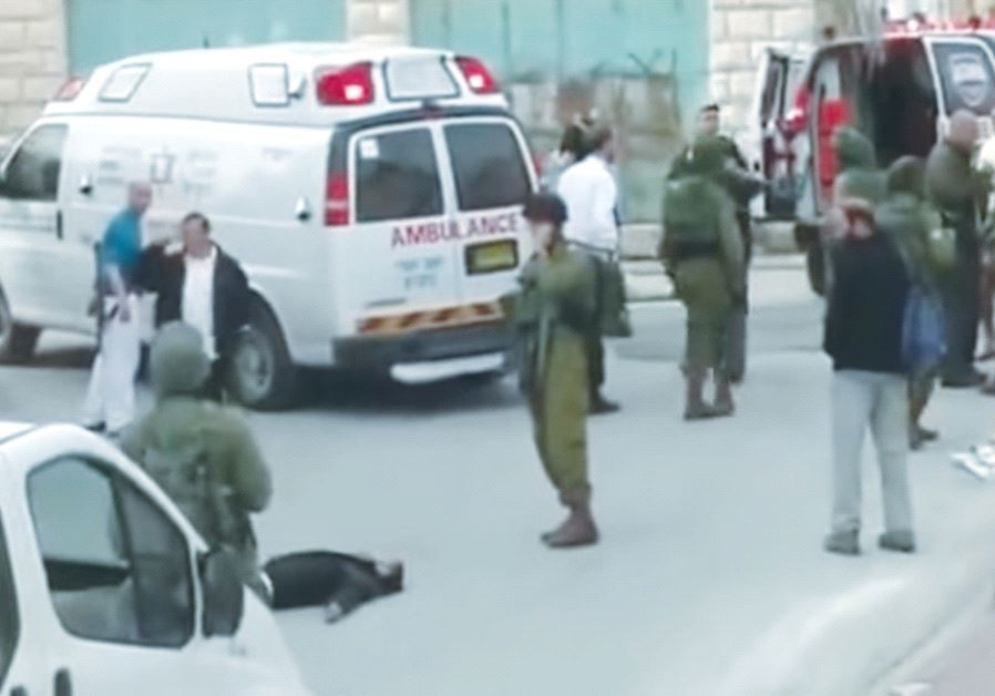 A STILL PHOTO from the famous video shows Sgt. Elor Azaria shooting an incapacitated terrorist in Hebron on March 24, 2016.