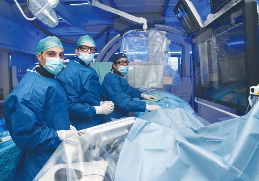 SURGEONS OPERATE at Soroka-University Medical Center in Beersheba.