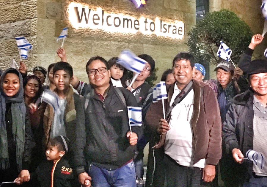 NEW IMMIGRANTS upon arrival at Ben-Gurion Airport. 