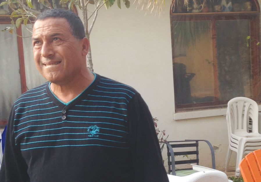 SHAIKE SHAKED stands in front of his house yesterday in Netiv Ha’asara along the Gaza border
