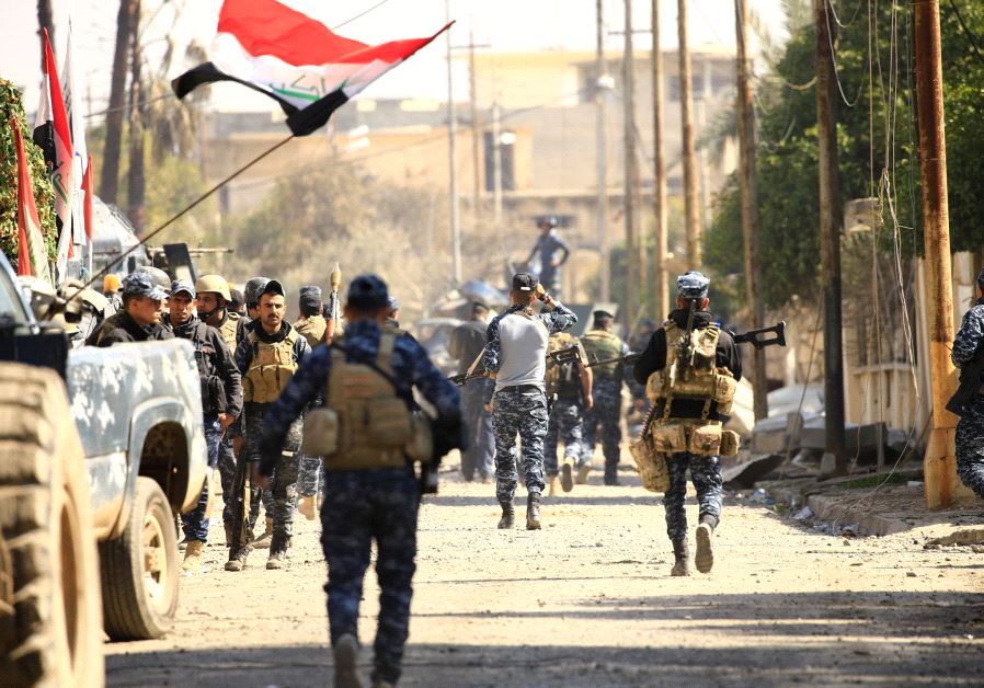 Federal police members are seen during a battle with Islamic State militants in Mosul, Iraq, March 6, 2017