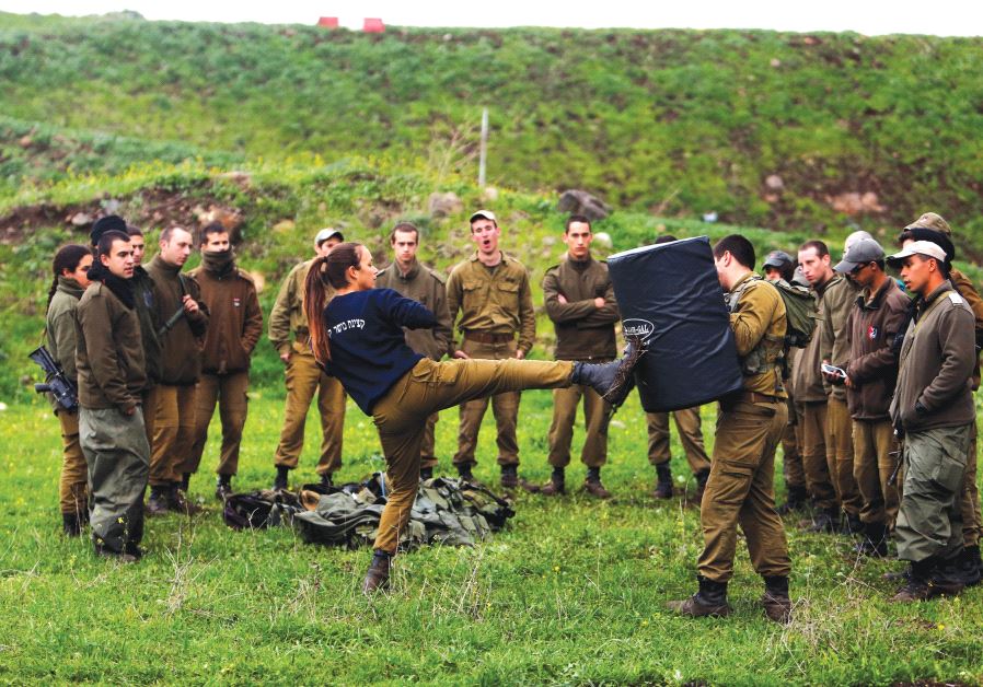 A FEMALE officer demonstrates a move a during a training session in Krav Maga, an Israeli self-defense technique, at a military base on the Golan Heights on March 1.