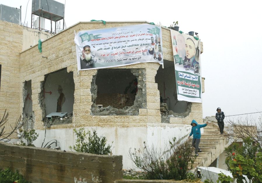 Children descend the stairs of the home that belonged to convicted terrorist Muhammad al- Haroub, in Deir Samt, south of Hebron, after it was partially demolished by the IDF in February 2016