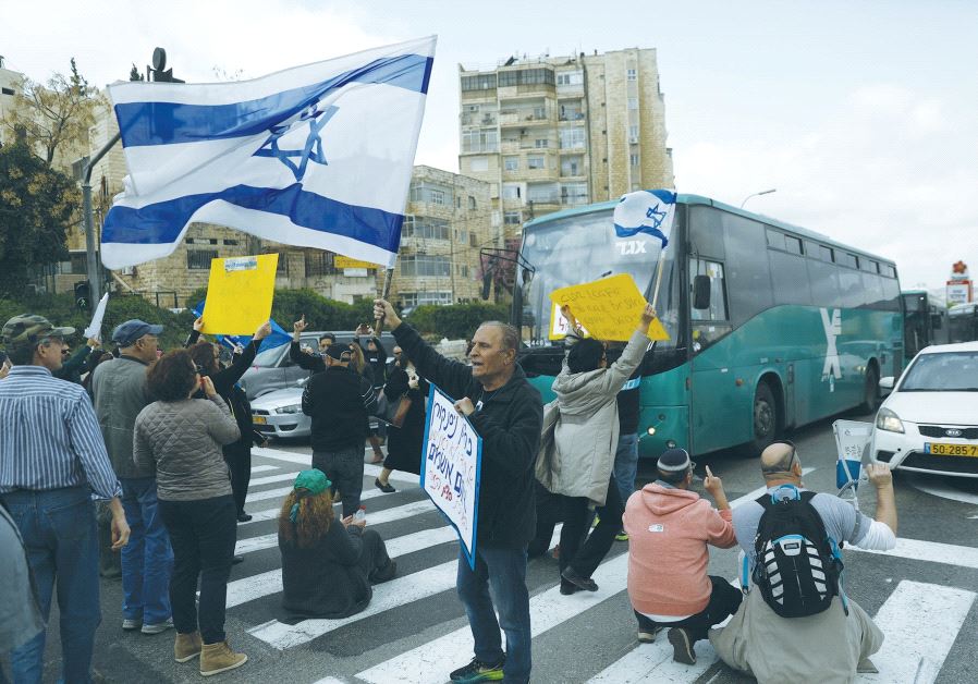 ISRAEL BROADCASTING AUTHORITY employees block the street during a protest against the Histadrut labor federation in Jerusalem yesterday.