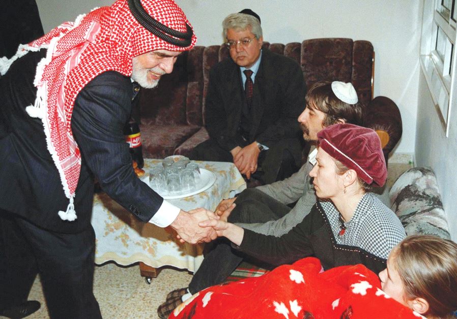 JORDAN’S KING Hussein leans over and shakes hands with Margalit Badayev, the mother of slain Israeli schoolgirl Shiri, during his 1997 condolence call at the mourning parent’s home. 