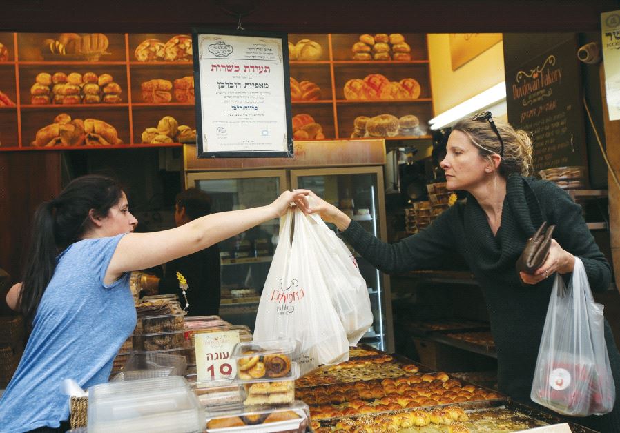 A Kashrut certificate hangs at the entrance to a bakery in Jerusalem’s Mahaneh Yehuda market