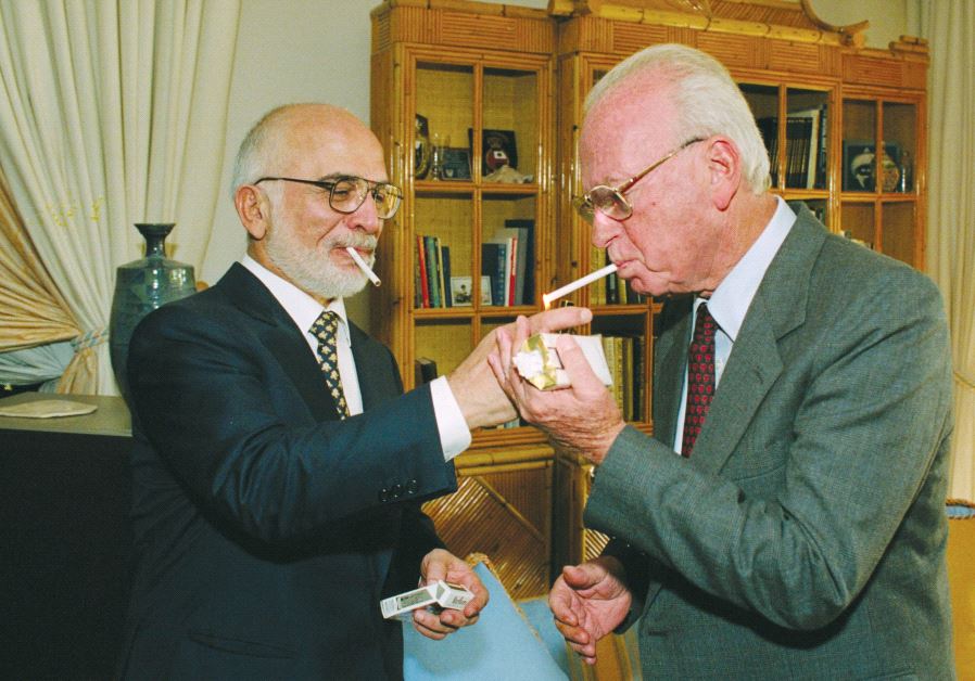 King Hussein of Jordan lights prime minister Yitzhak Rabin’s cigarette at the royal residence in Aqaba after signing a peace treaty