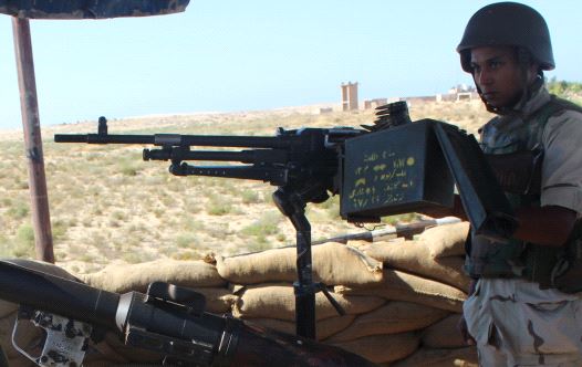 An Egyptian army soldier looks on from his postion at a checkpoint in Al Arish city, the troubled northern part of the Sinai peninsula