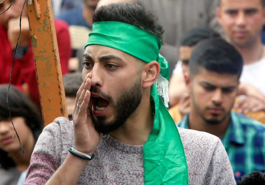 A Hamas supporter shouts anti-Israel slogans in front of the family house of Palestinian senior Hamas militant Mazen Fuqaha in the West Bank town of Tubas, near Jenin, March 25, 2017.