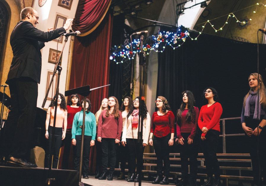 Micah Hendler directs the YMCA Jerusalem Youth Chorus