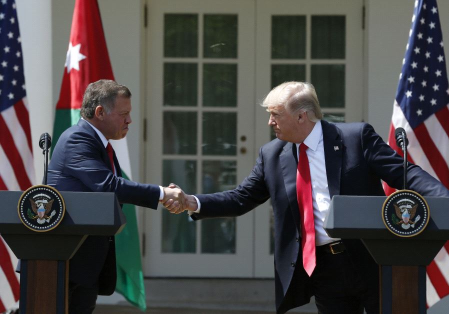 US President Trump greets Jordan's King Abdullah II during joint news conference at the White House