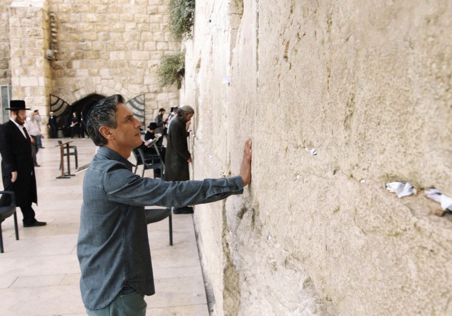 REZA ASLAN, host of CNN’s series ‘Believer,’ stands at the Western Wall in 2015 during the filming of an episode in Israel.