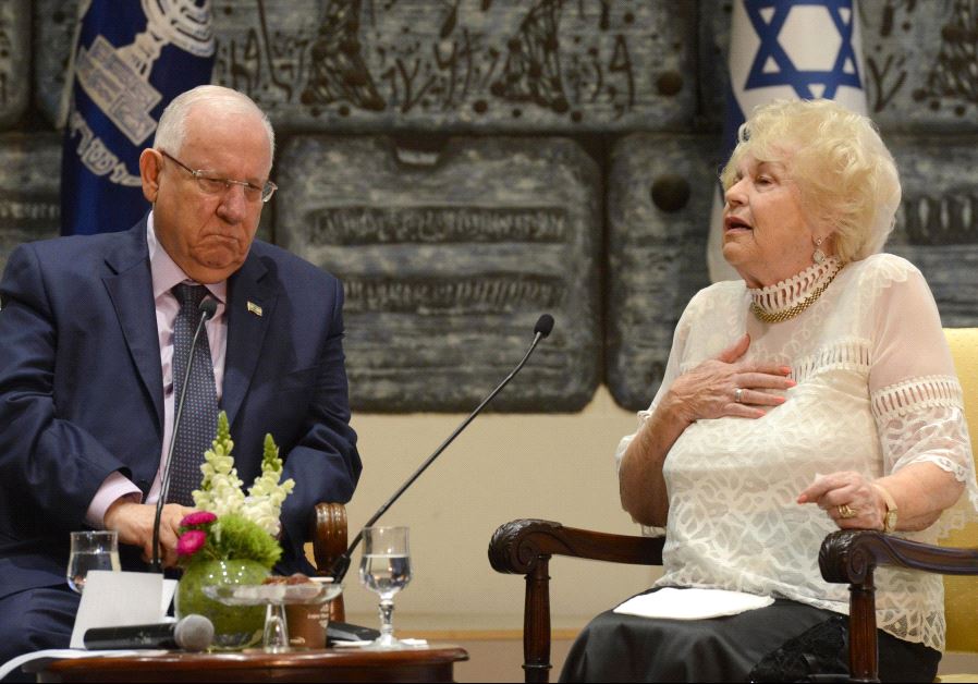 President Reuven Rivlin speaks to Holocaust survivor Miriam Eshel.