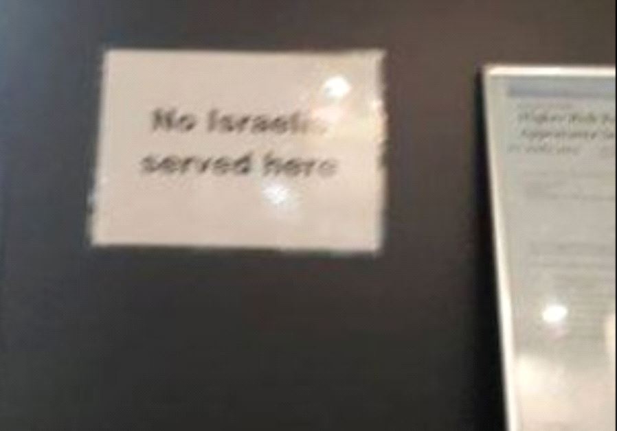 A sign saying “No Israelis served here” at Cold Steel Piercing in Cairns, North Queensland