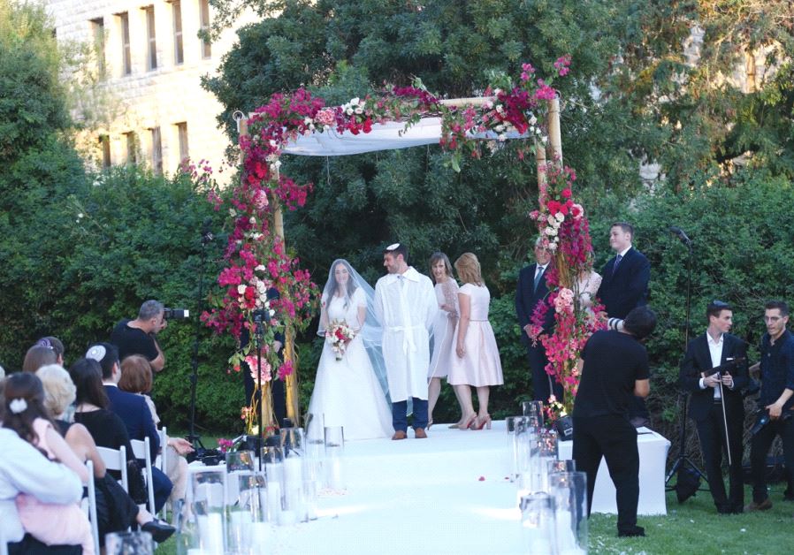 The mother of the groom surprised this couple with a custom-made huppa