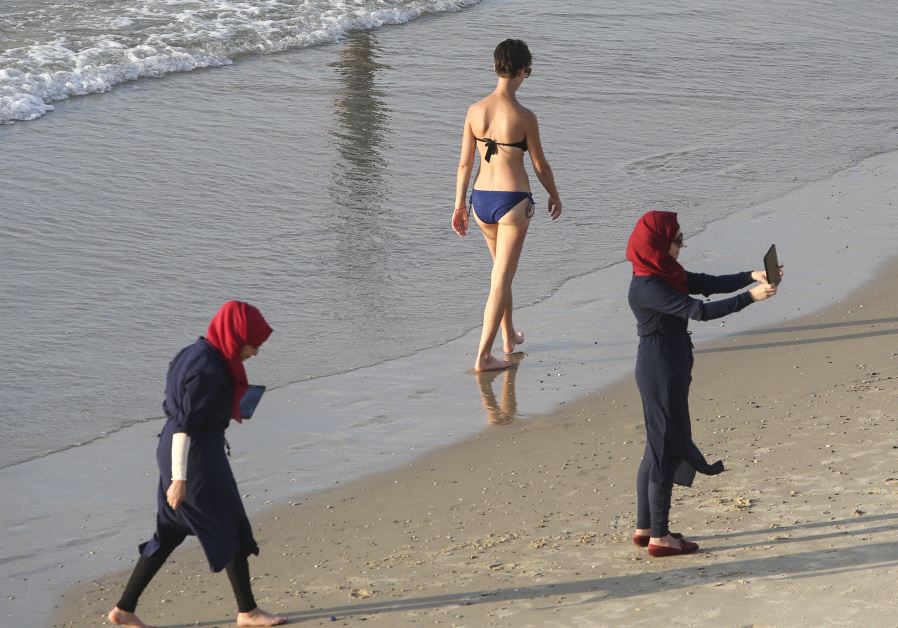 Arab women wearing burkinis at a beach in Tel Aviv