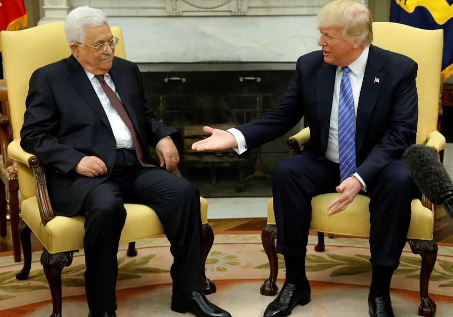 US President Donald Trump (R) welcomes Palestinian Authority President Mahmoud Abbas in the Oval Office at the White House in Washington on May 3, 2017
