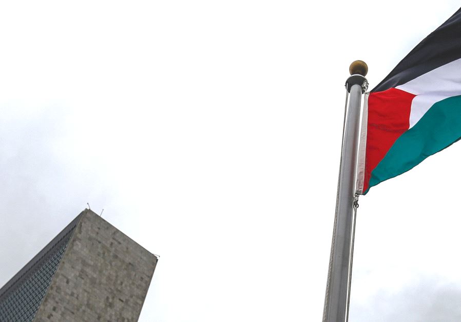THE PALESTINIAN flag flies next to UN Headquarters in New York