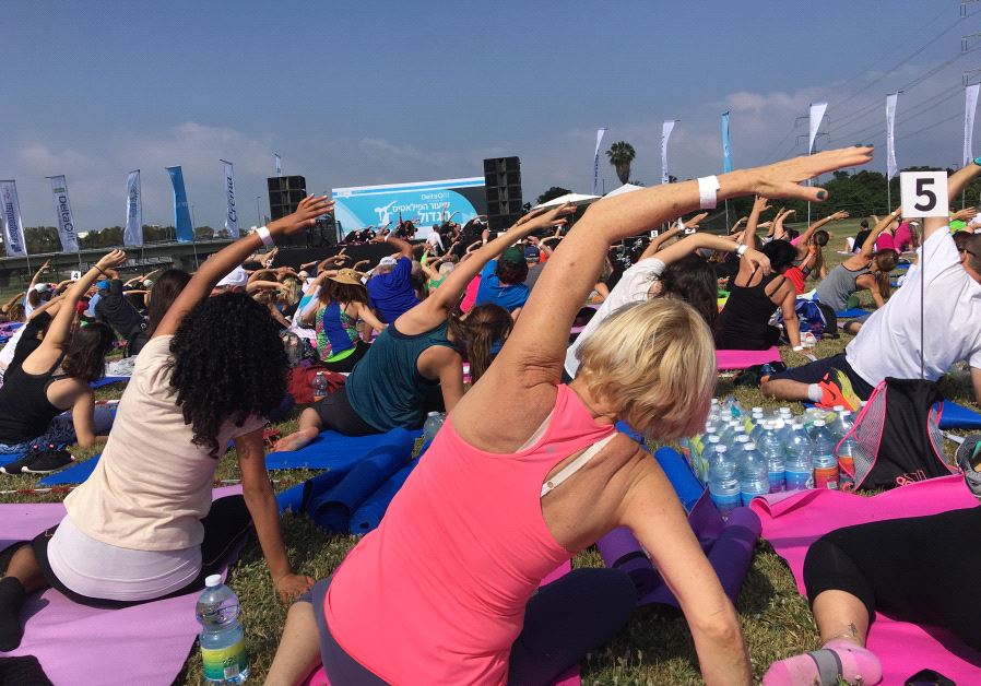 Israeli fitness buffs gather in Tel Aviv to hold the biggest Pilates class ever in Israel