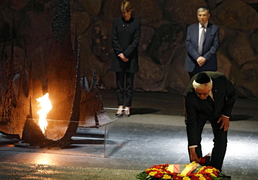 German President Frank-Walter Steinmeier touches a wreath during a ceremony commemorating the six million Jews killed by the Nazis in the Holocaust, in the Hall of Remembrance at Yad Vashem Holocaust memorial in Jerusalem