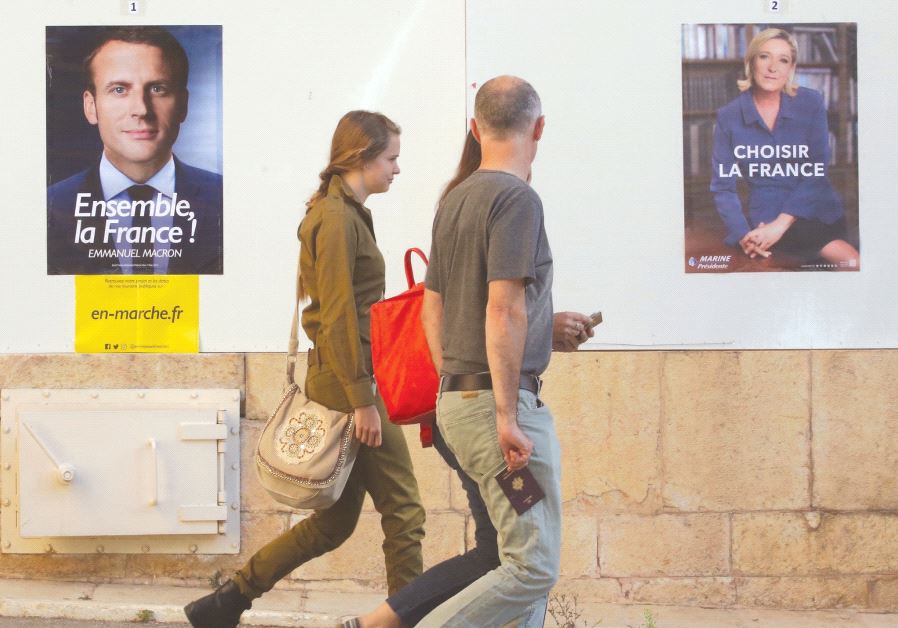PEOPLE HEAD to a polling station in the French consulate in Jerusalem to vote in the presidential elections.