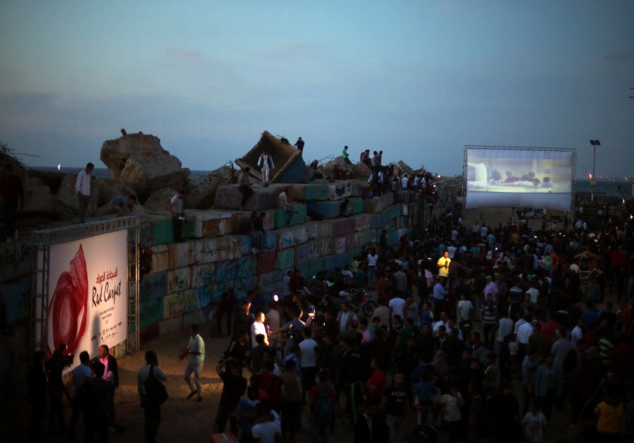 A film is screened during the third edition of the Red Carpet Film Festival, at the seaport of Gaza City May 12, 2017.