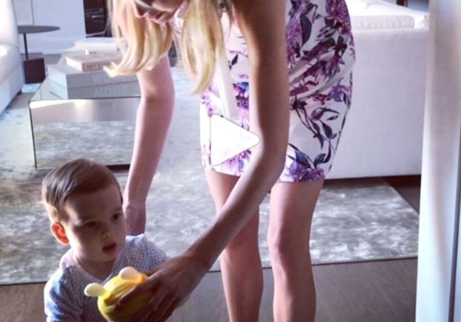 Ivanka Trump helping her son Theodore take his first steps.