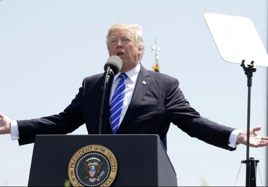 President Donald Trump addresses the graduating class of the US Coast Guard Academy in New London, Connecticut.