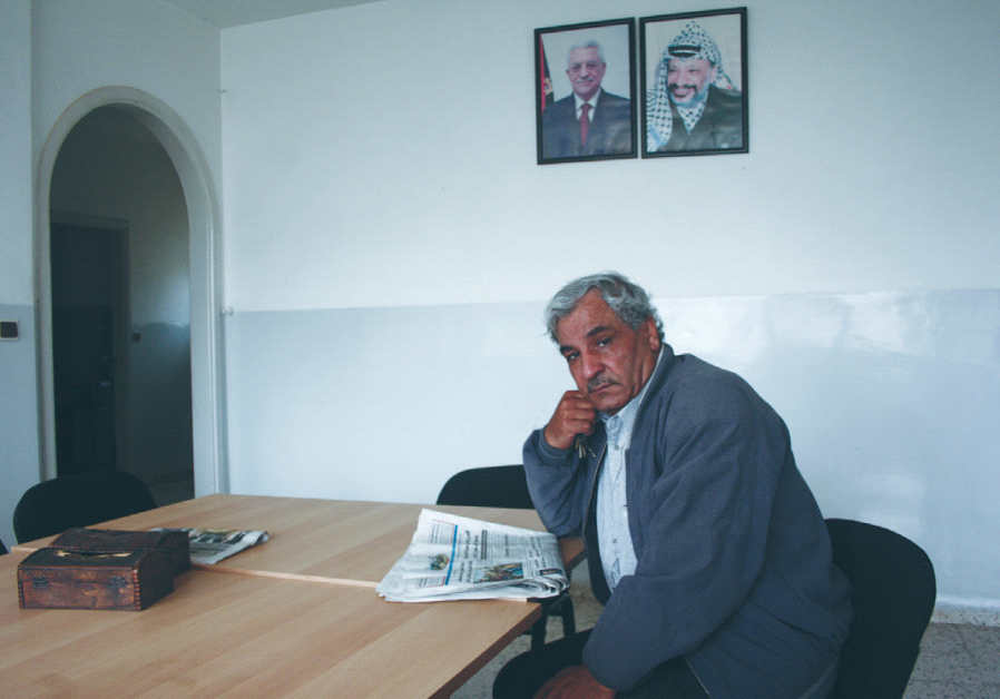 AWNI AL-MASHNI sits in his office in Ramallah earlier this month.