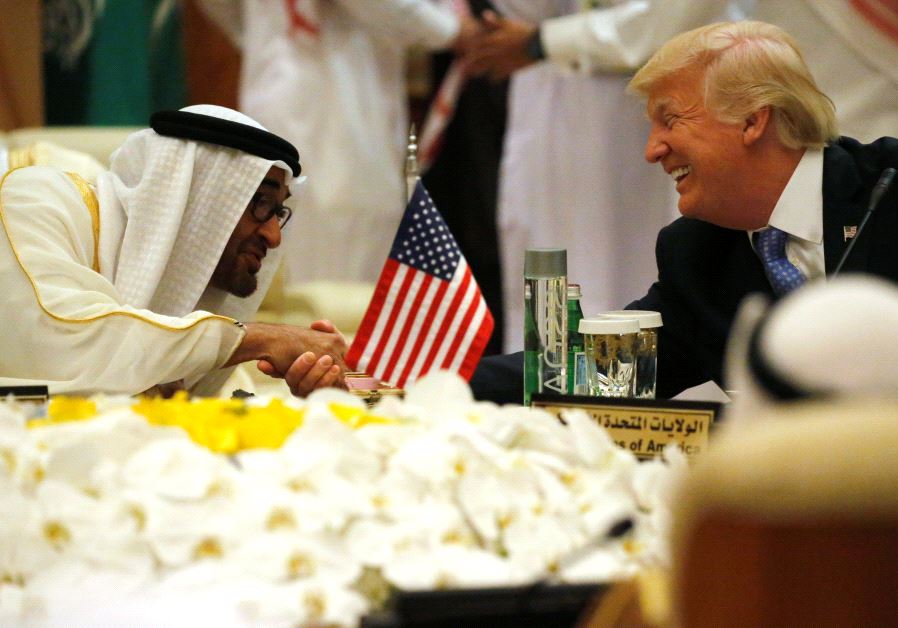 US President Donald Trump shakes hands with Abu Dhabi Crown Prince and Deputy Supreme Commander of the United Arab Emirates Armed Forces Mohammed bin Zayed al-Nahayan as he sits down to a meeting with of Gulf Cooperation Council leaders during their summit in Riyadh, Saudi Arabia