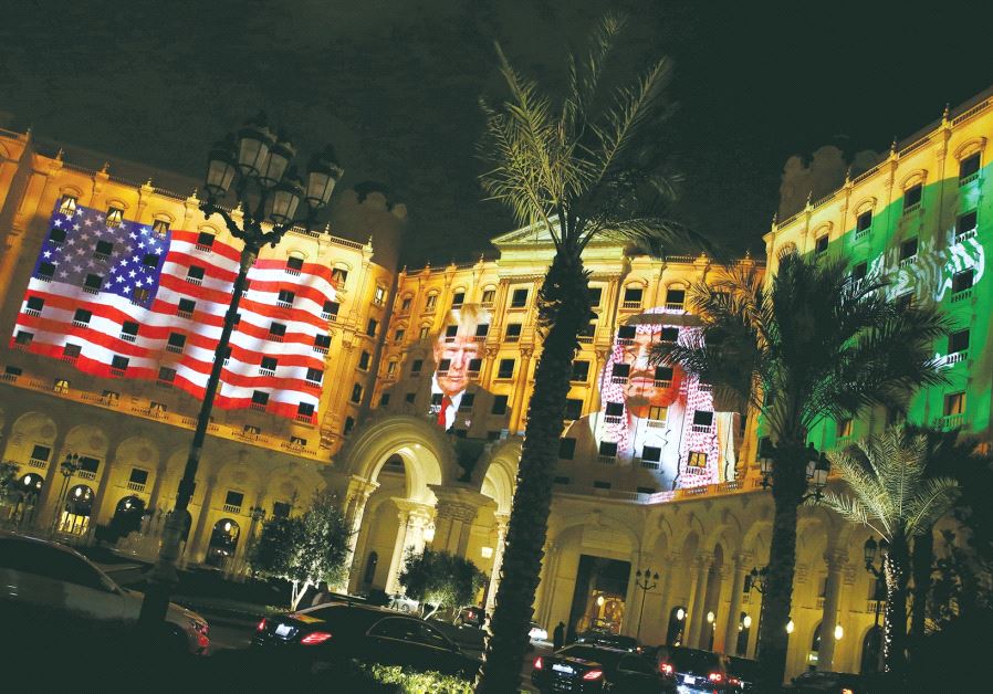 IMAGES of US President Donald Trump and Saudi Arabian King Salman bin Abdulaziz Al Saud are projected Saturday on the front of the Ritz-Carlton, where Trump was staying in Riyadh