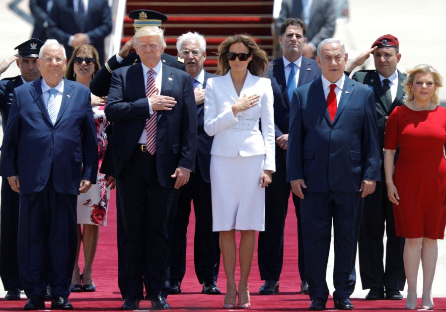 US President Donald Trump (2nd L) and first lady Melania Trump (3rd L) walk with Israeli Prime Minister Benjamin Netanyahu (2nd R), his wife Sara (R) and David Friedman (Center back), the new United States Ambassador to Israel, upon their arrival at Ben Gurion International Airport in Lod near Tel A