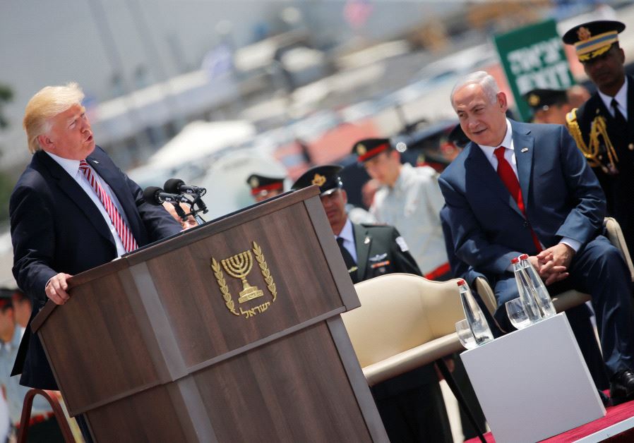 Prime Minister Benjamin Netanyahu (R) listens as U.S. President Donald Trump (L) speaks during a welcoming ceremony upon his arrival at Ben Gurion International Airport in Lod near Tel Aviv, Israel May 22, 2017
