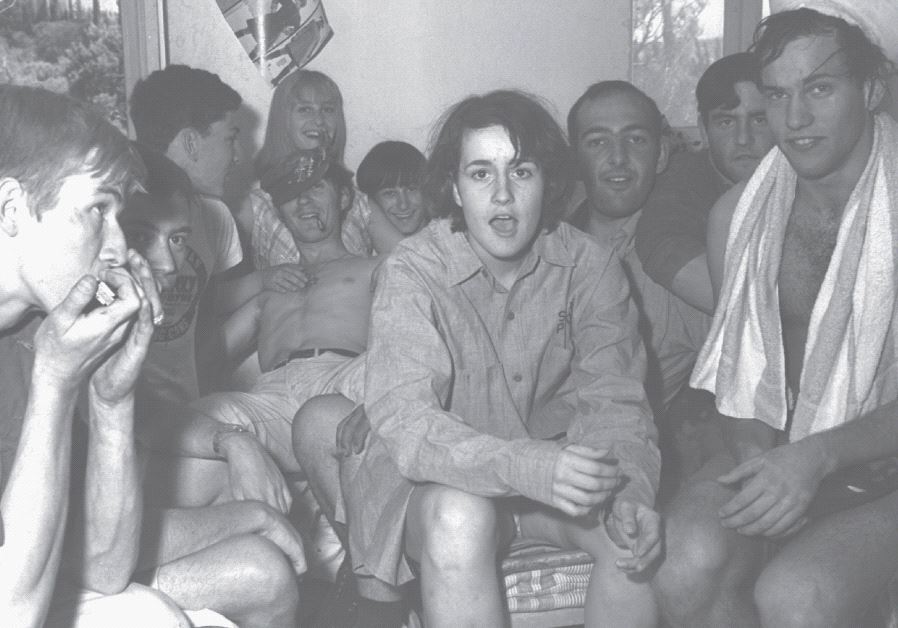 A group of foreign volunteers who came in August 1967 to clean up the university’s premises after the war, gathering after work in one of the rooms at their living quarters on Mount Scopus, Jerusalem