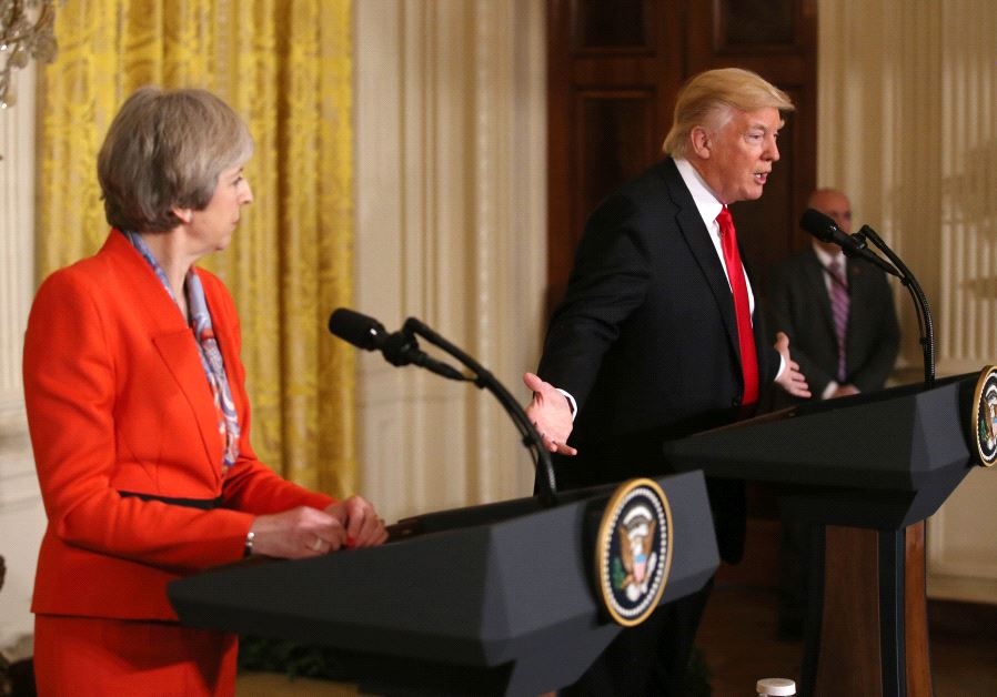 British Prime Minister Theresa May looks on as US President Donald Trump speaks during their joint news conference at the White House in Washington, January 27, 2017