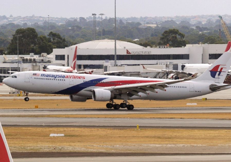 A Malaysia Airlines Airbus A330 commercial flight lands at Perth International Airport March 26, 2014. 