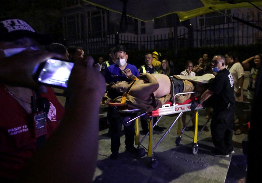 An injured hotel guest is seen outside of a hotel after a shooting incident inside Resorts World Manila in Pasay City, Metro Manila, Philippines June 2, 2017