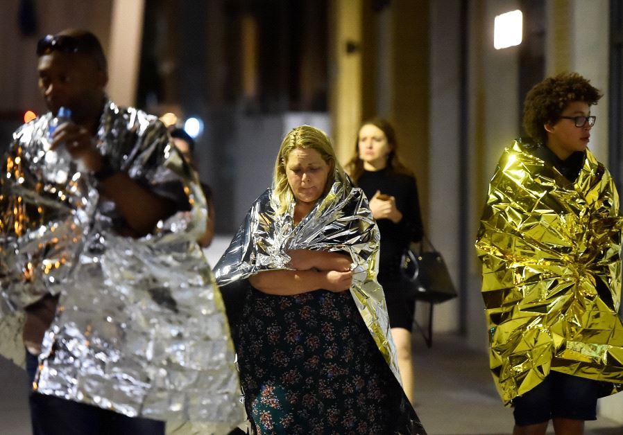 People flee as police attend to an incident near London Bridge in London