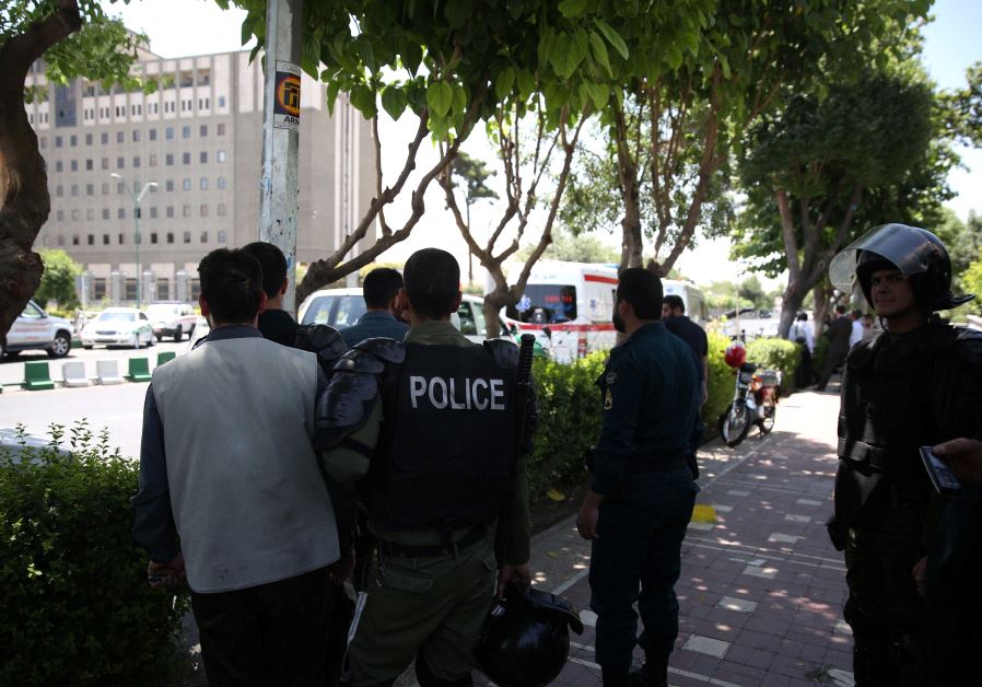Iranian police stand near the parliament's building during a gunmen attack in central Tehran, Iran, June 7, 2017