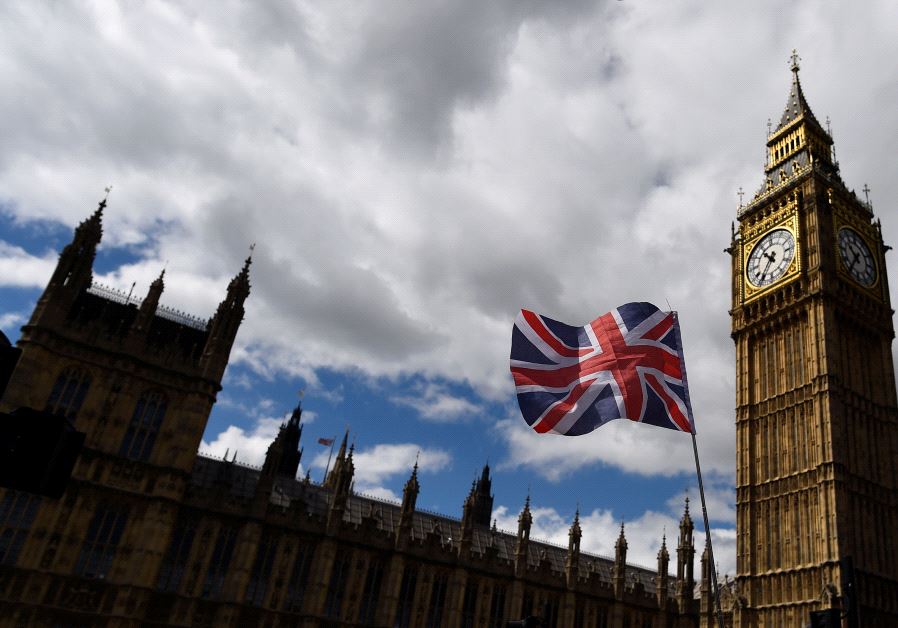 The Union Flag flies near the Houses of Parliament the day before a general election in central London, Britain June 7, 2017.