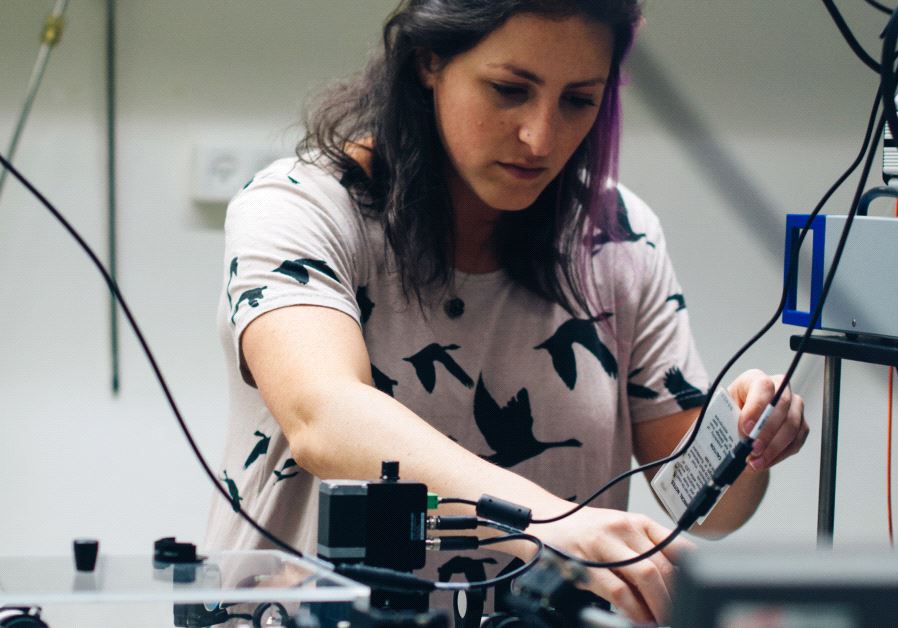 Graduate student Yifat Baruchi in Prof. Ronen Rapaport's lab, testing a photon measurement setup, at the Hebrew University's Quantum Information Science Center