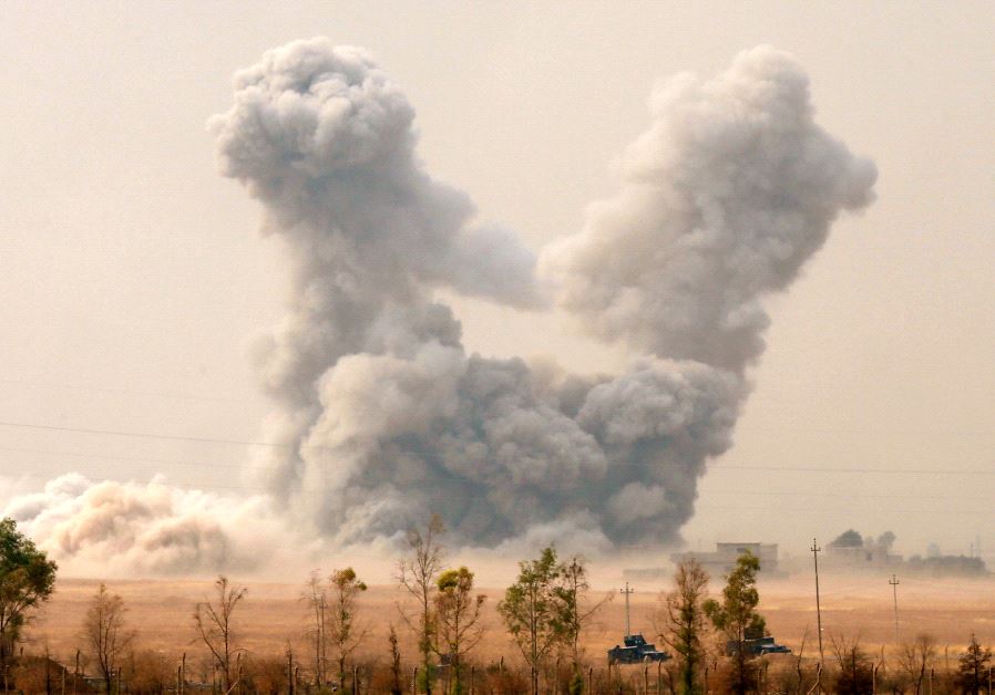 Smoke rises after an US airstrike, while the Iraqi army pushes into Topzawa village during the operation against Islamic State militants near Bashiqa, near Mosul, Iraq October 24, 2016. 